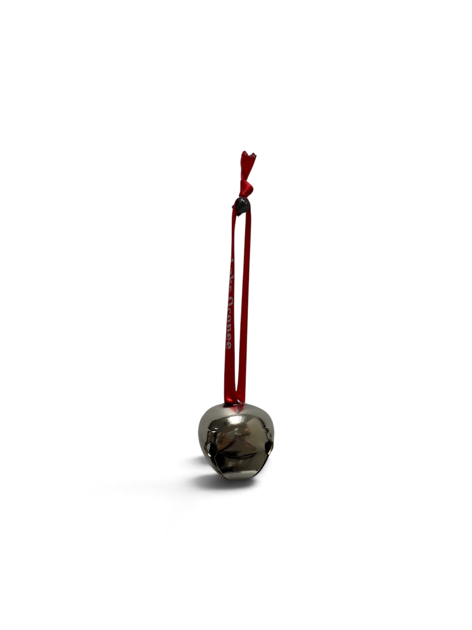 a silver bell with a red string