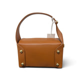 a brown leather bag with a white tag