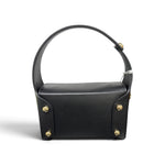 a black leather bag with gold accents