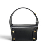 a black leather bag with gold accents
