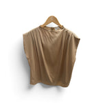 a tan shirt on a swinger