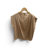 a tan shirt on a swinger