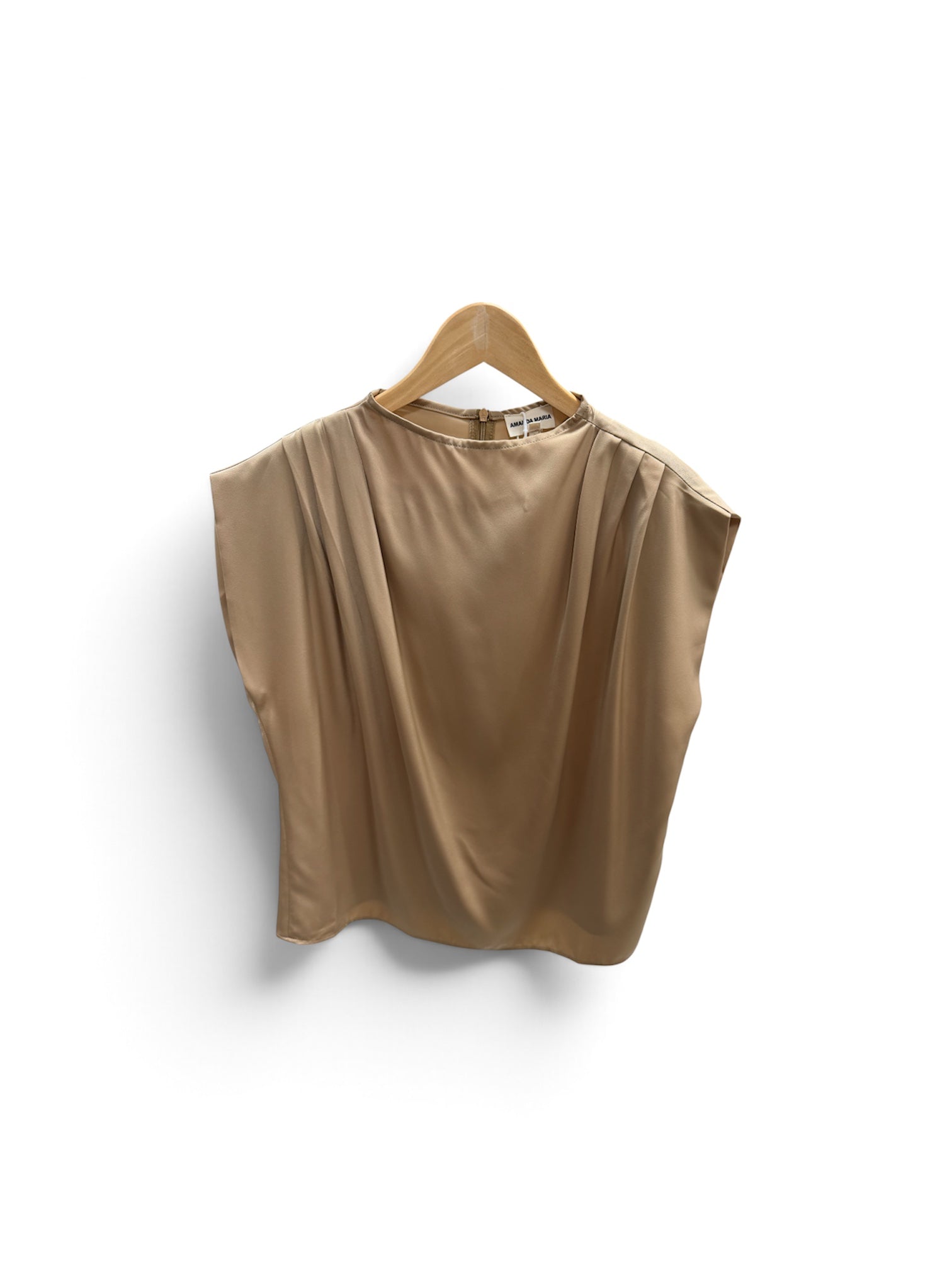 a tan shirt on a swinger