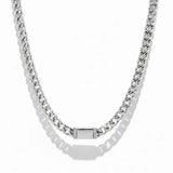 a silver chain with a square object on it