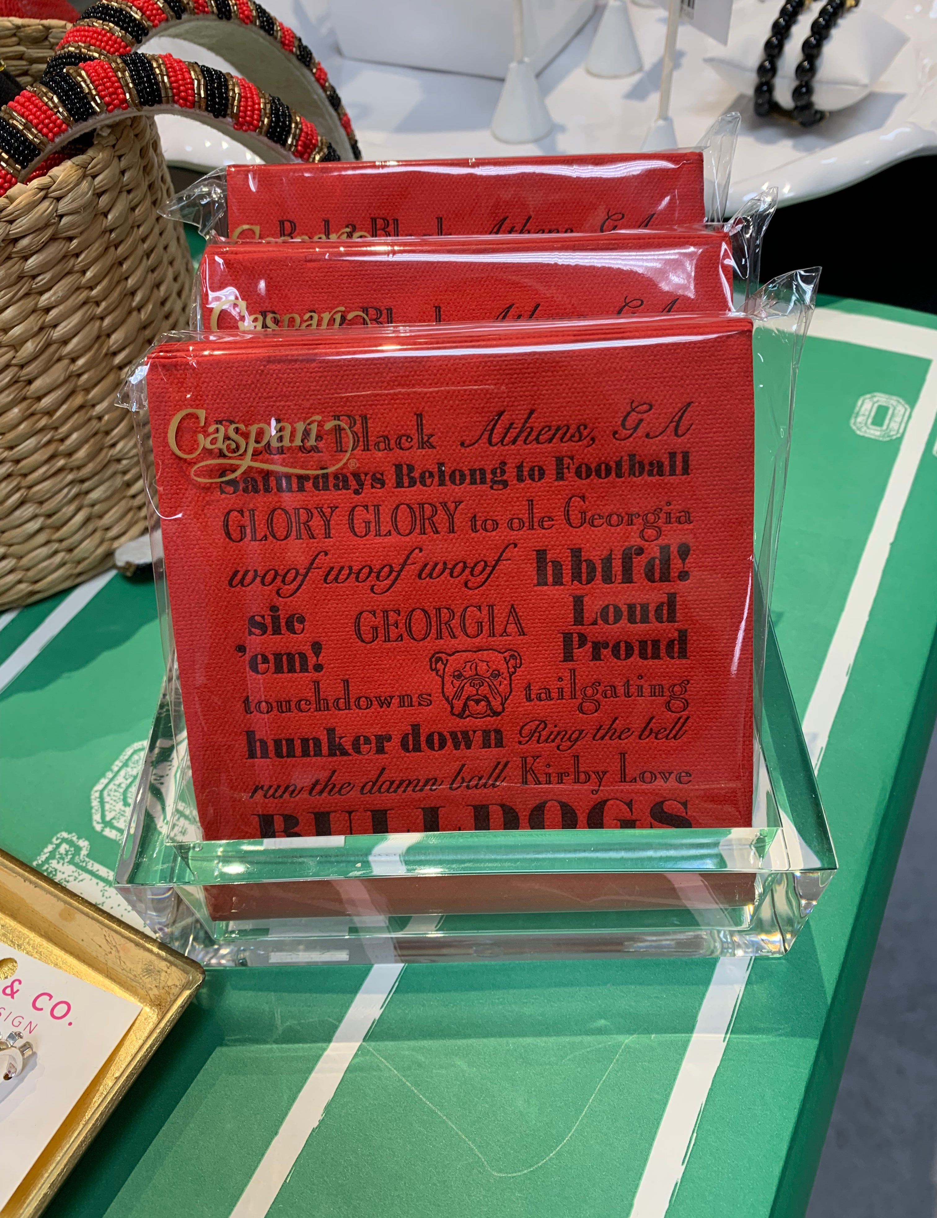 a red napkins in a clear holder
