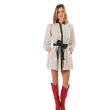 a woman in a white dress with red boots