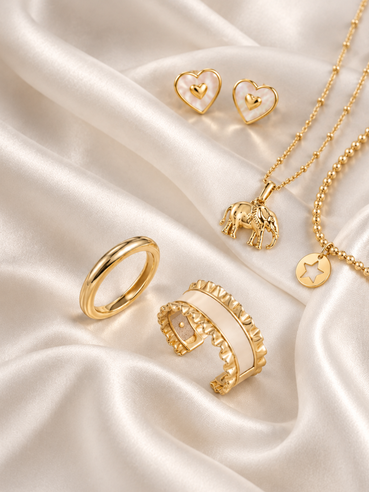 a gold jewelry on a white fabric