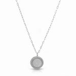 a silver necklace with a round pendant