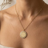a woman wearing a necklace