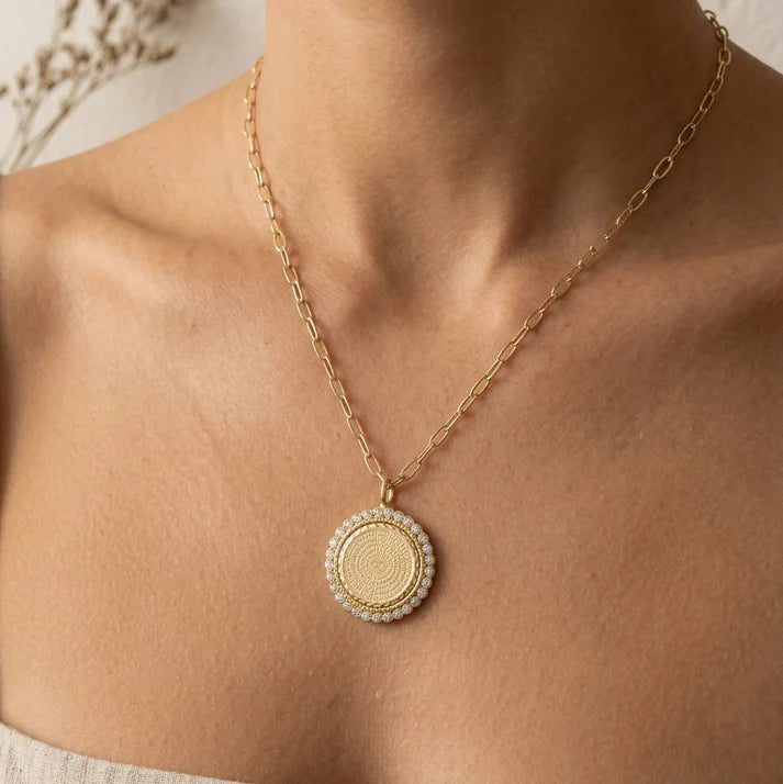 a woman wearing a necklace