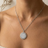 a woman wearing a necklace