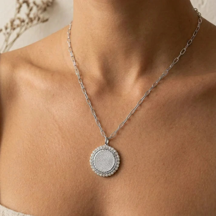 a woman wearing a necklace