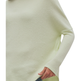 a person wearing a white sweater