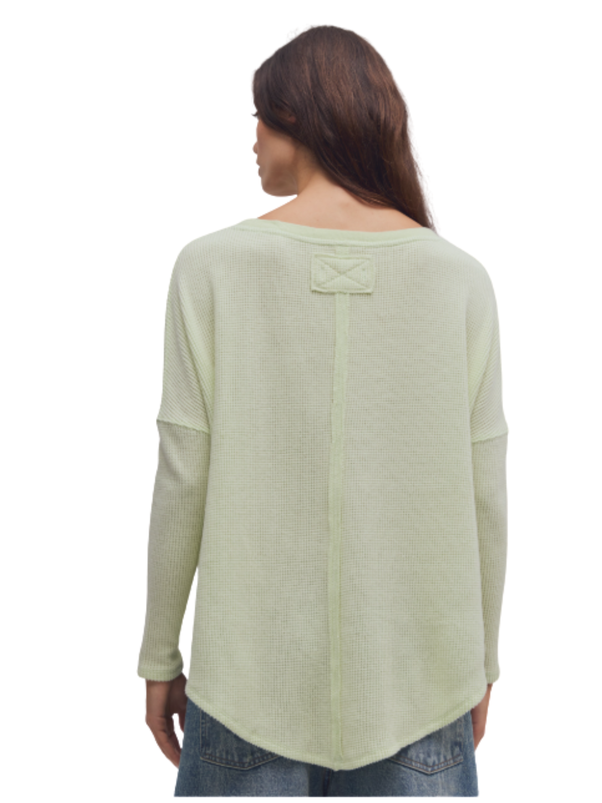 a woman wearing a green sweater