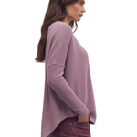 a woman in a purple sweater
