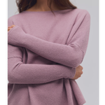 a woman with her arms crossed