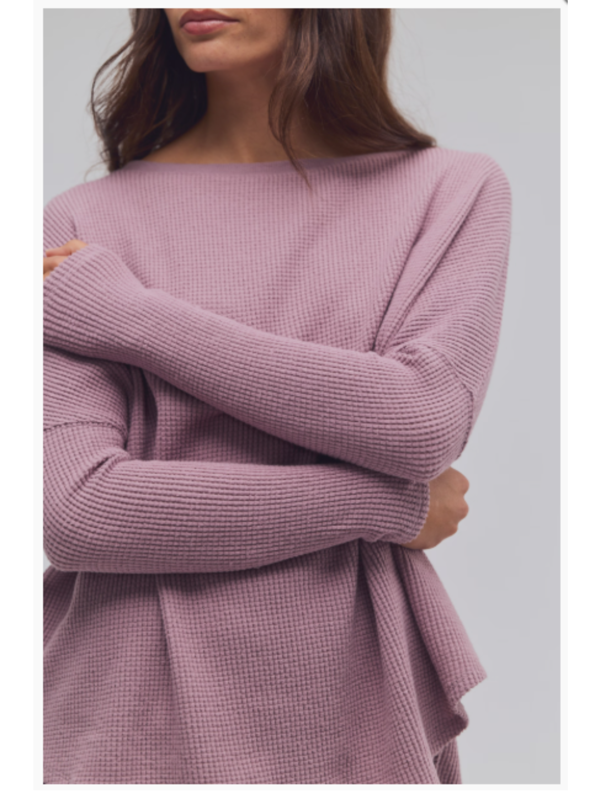 a woman with her arms crossed