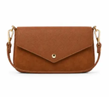 a brown leather bag with gold handles