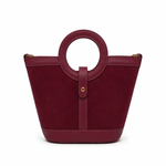 a red purse with a round handle