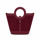a red purse with a round handle