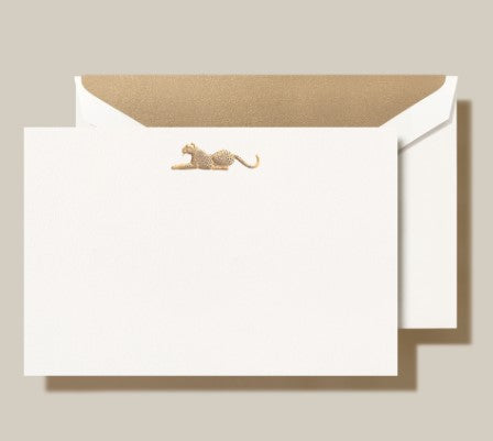 a white envelope with a gold clip