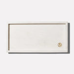 a rectangular white rectangular object with a gold logo