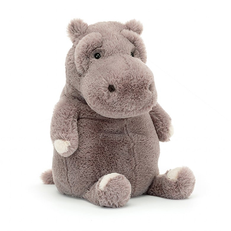 a stuffed animal hippo on a white background