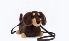 a stuffed dog with a leash