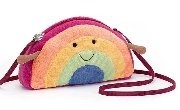 a colorful purse with a rainbow face