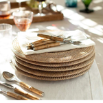 a stack of plates and spoons