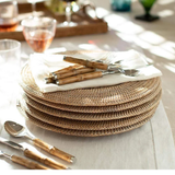a stack of plates and spoons