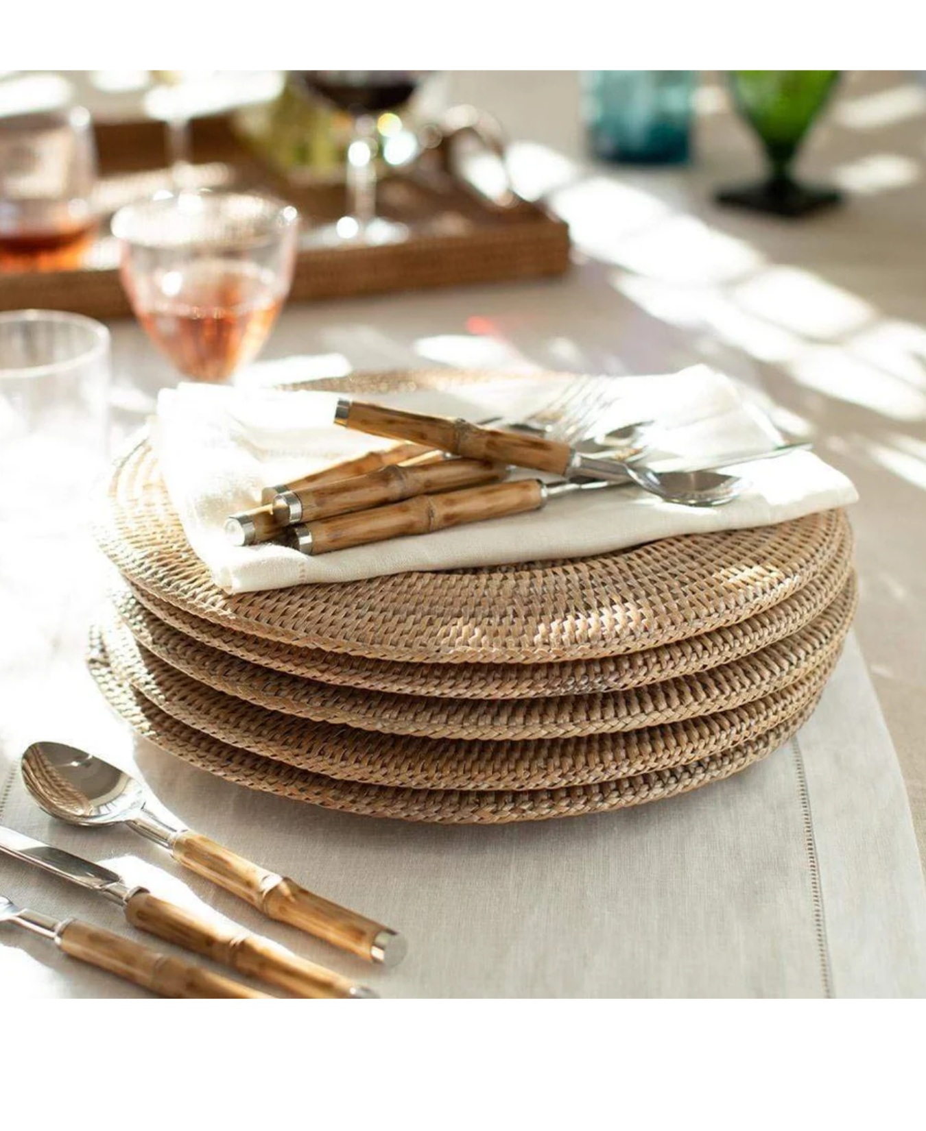 a stack of plates and spoons
