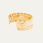 a gold ring with a white band