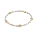 a white and gold bracelet