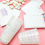 a group of objects on a pink surface