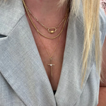 a woman wearing a necklace