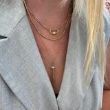 a woman wearing a necklace