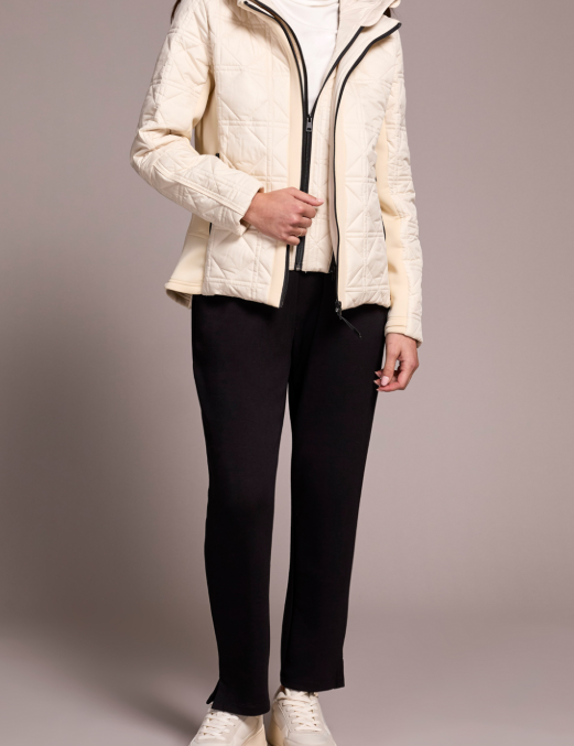 a woman in a white jacket