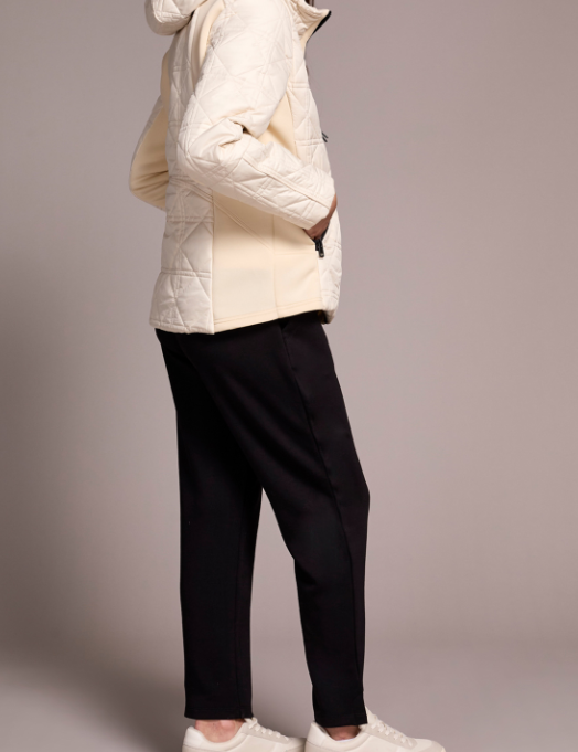 a woman in a white coat
