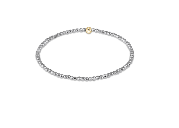 a silver and gold beaded bracelet