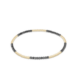 a black and gold beaded bracelet