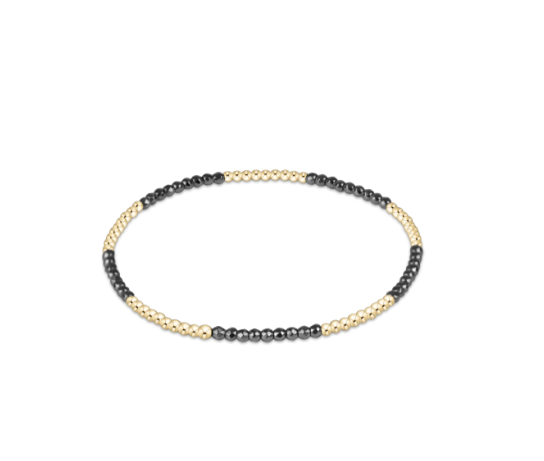 a black and gold beaded bracelet