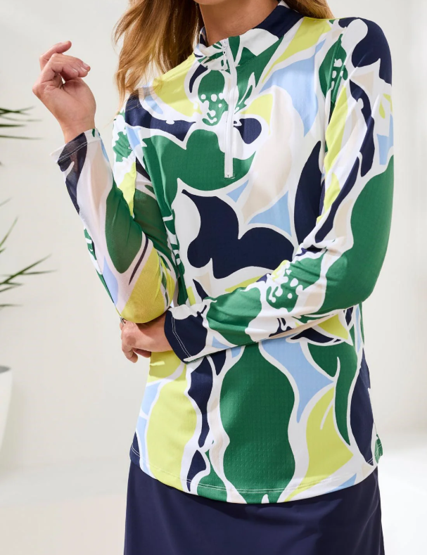 a woman wearing a colorful shirt