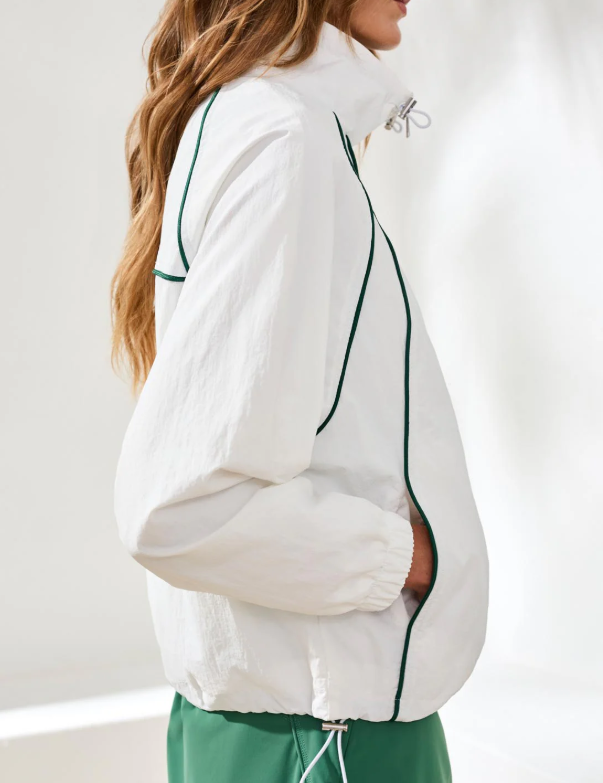 a woman in a white jacket