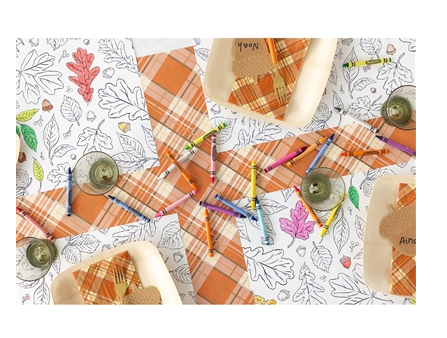a table with plates and crayons