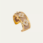 a gold and silver bracelet with flowers