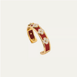 a red and gold bracelet with white flowers