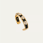 a black and gold bracelet with white flowers