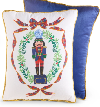 a blue and white pillow with a nutcracker on it