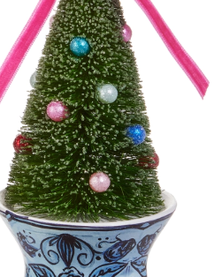 a small christmas tree in a bowl